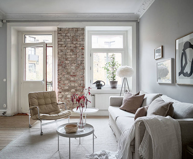 Нежный скандинавский интерьер с кирпичной стеной