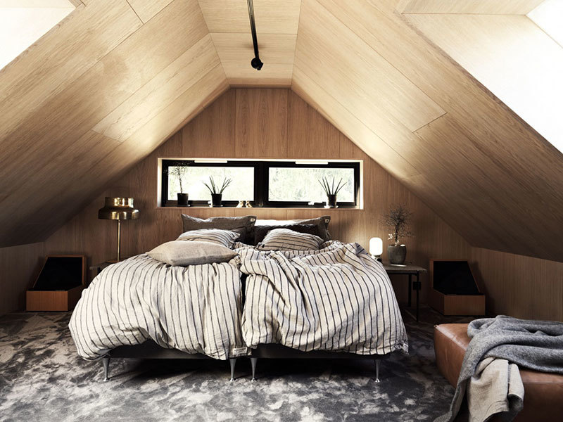 Стильный интерьер деревянного коттеджа в темных тонах в Швеции