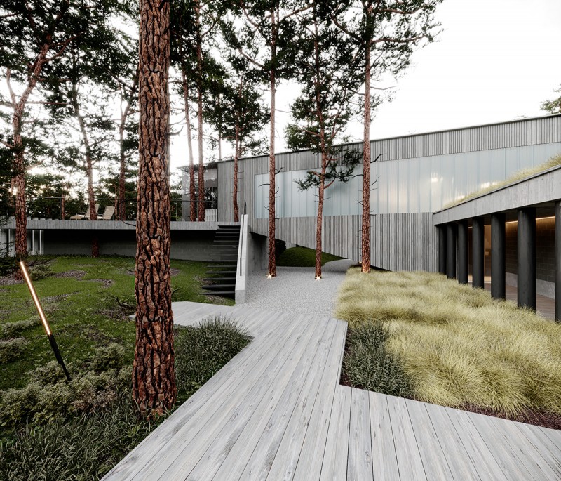 Строгий дизайн дома, расположенного на земле со сложным рельефом