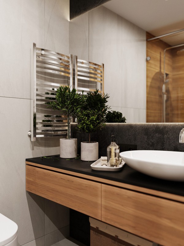 Акцент на зеленый и глубокий синий в интерьере квартиры, оформленной в спокойных серых тонах