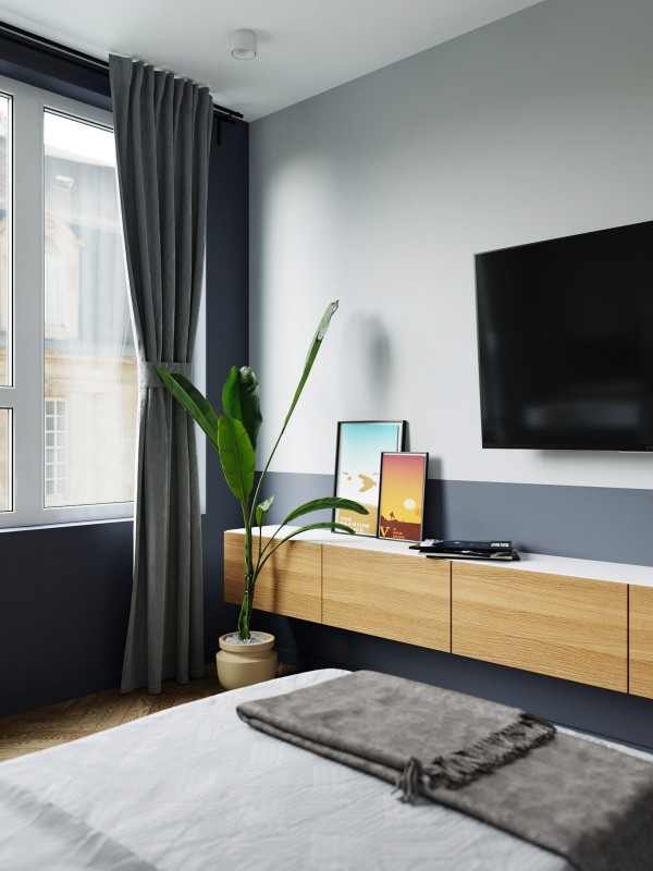 Акцент на зеленый и глубокий синий в интерьере квартиры, оформленной в спокойных серых тонах