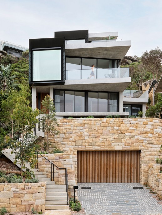 Современный дом на скалистом склоне над океаном в Сиднее