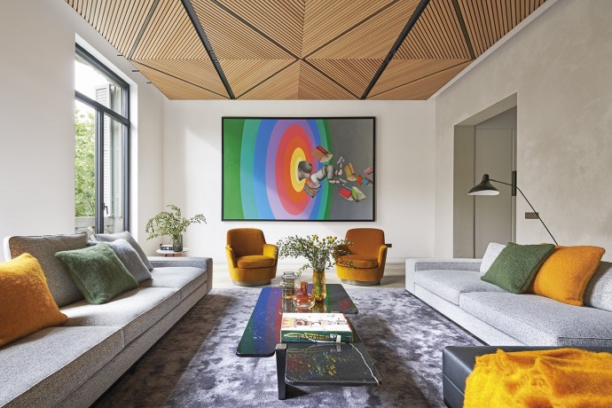 Теплые текстуры, интенсивные цвета и много света в интерьере барселонской квартиры